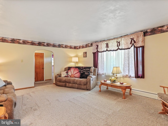 4126 Coseytown Rd, Greencastle, PA 17225 - carpeted living area with arched walkways, baseboards, and a baseboard radiator