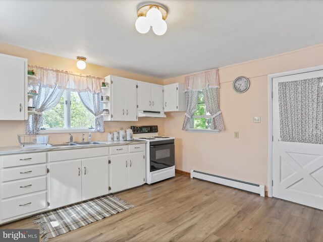 4126 Coseytown Rd, Greencastle, PA 17225 - kitchen featuring baseboard heating, range with electric stovetop, open shelves, under cabinet range hood, and a sink