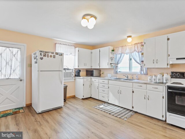 4126 Coseytown Rd, Greencastle, PA 17225 - kitchen with freestanding refrigerator, under cabinet range hood, electric range oven, a sink, and light countertops