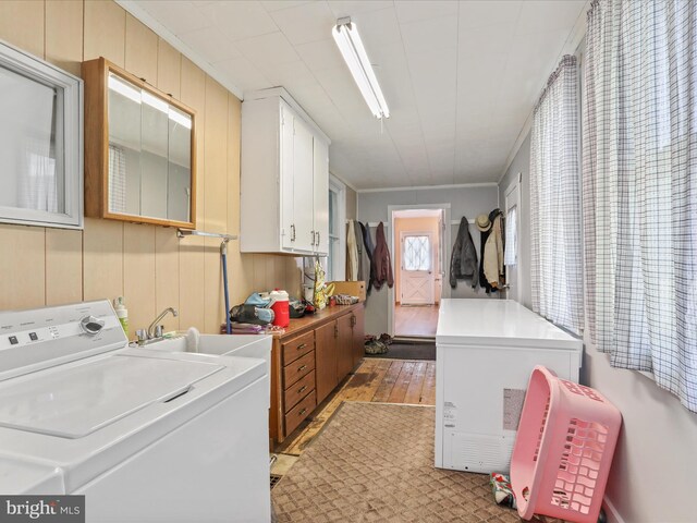 4126 Coseytown Rd, Greencastle, PA 17225 - washroom with washer / dryer, light wood-style flooring, cabinet space, and ornamental molding