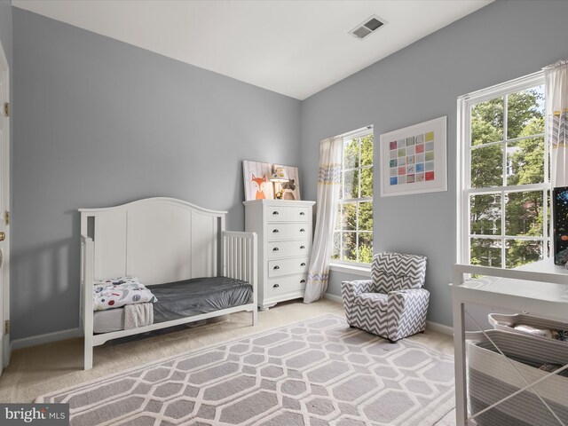 carpeted bedroom featuring baseboards
