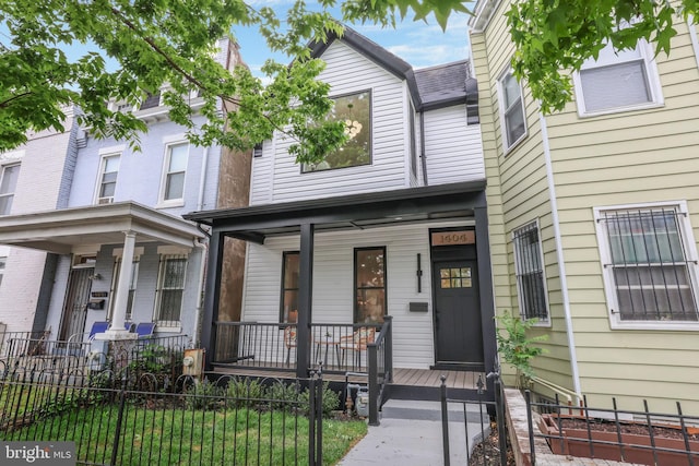 1404 Montello Ave NE, Washington, DC 20002 - multi unit property featuring a porch and a fenced front yard