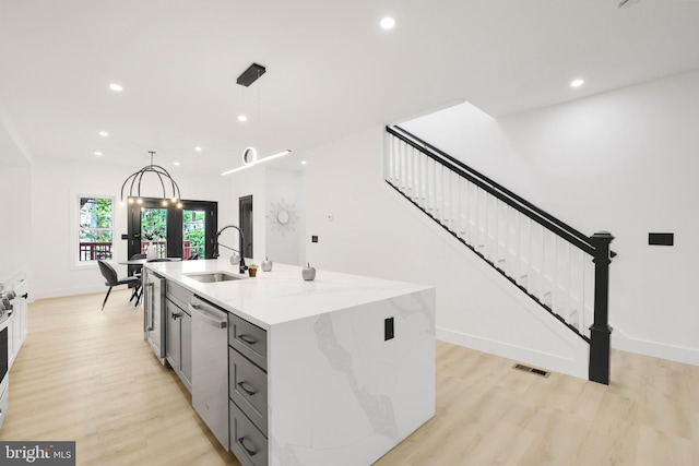1404 Montello Ave NE, Washington, DC 20002 - kitchen with a sink, dishwasher, recessed lighting, light wood finished floors, and pendant lighting