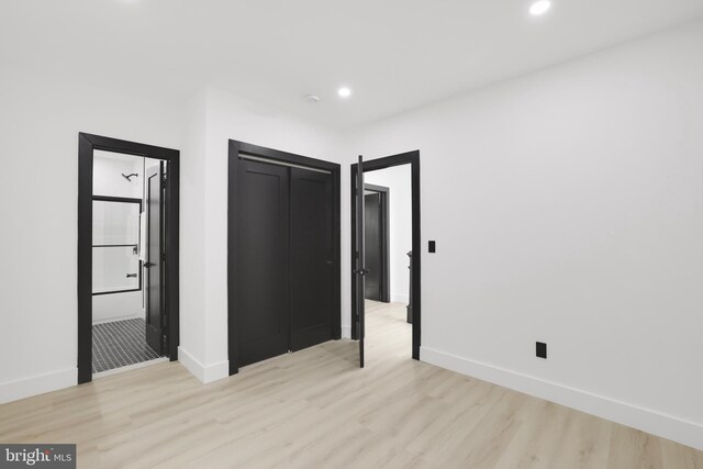 1404 Montello Ave NE, Washington, DC 20002 - unfurnished bedroom with light wood-style flooring, recessed lighting, and baseboards