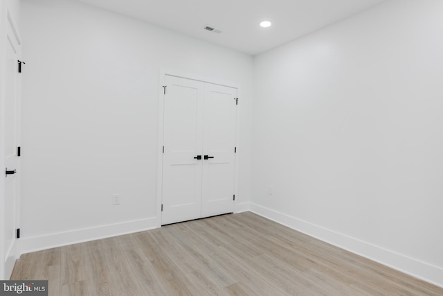 1801 Otis St NE Unit 6, Washington, DC 20018 - unfurnished bedroom with light wood-style floors, recessed lighting, and a closet