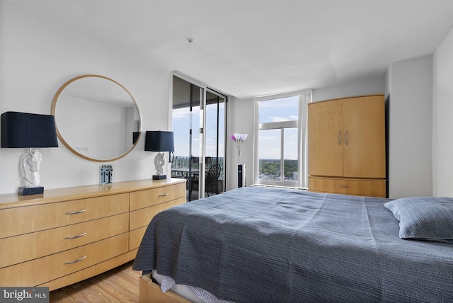 bedroom with light wood-type flooring
