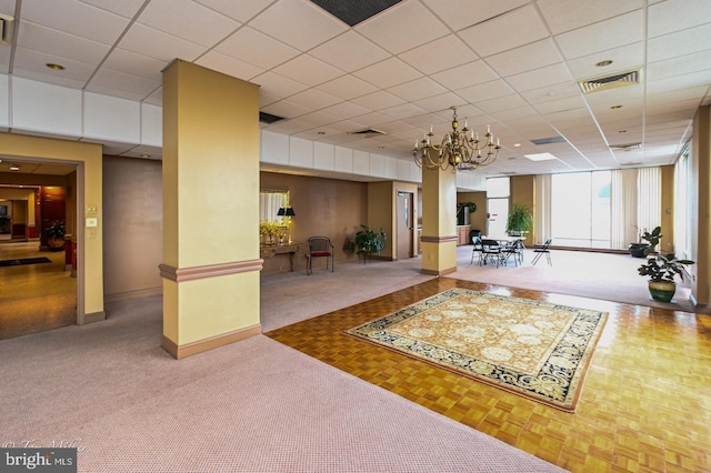 lobby featuring a drop ceiling