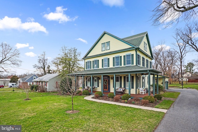 16 Glyndon Ave, Glyndon, MD 21071 - view of front of house featuring a porch and a front lawn