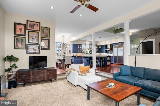 16 Glyndon Ave, Glyndon, MD 21071 - carpeted living room featuring decorative columns, a ceiling fan, a chandelier, and recessed lighting
