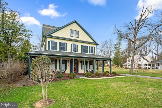 16 Glyndon Ave, Glyndon, MD 21071 - farmhouse-style home with covered porch and a front yard