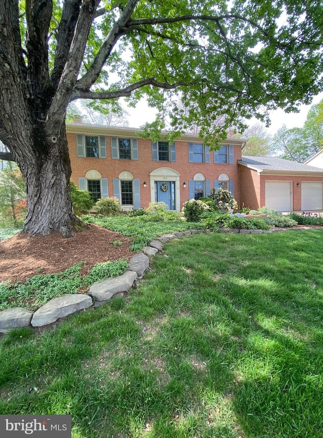 4614 Demby Dr, Fairfax, VA 22032 - colonial home with brick siding, a garage, and a front lawn