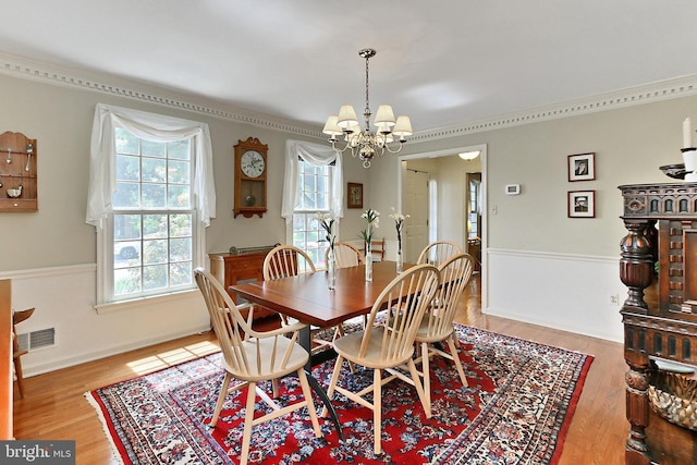 4614 Demby Dr, Fairfax, VA 22032 - dining room with a chandelier, wood finished floors, crown molding, and baseboards