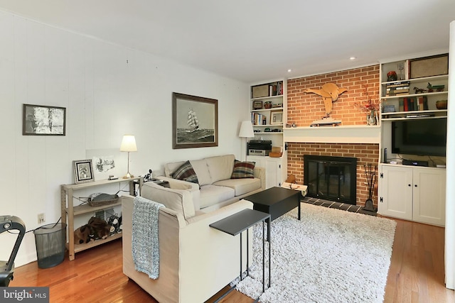 4614 Demby Dr, Fairfax, VA 22032 - living area with wood finished floors, a fireplace, and built in features