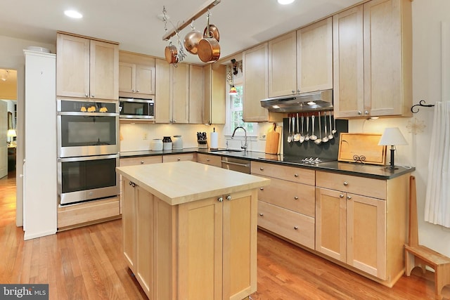 4614 Demby Dr, Fairfax, VA 22032 - kitchen featuring under cabinet range hood, appliances with stainless steel finishes, a sink, light brown cabinetry, and light wood-style flooring