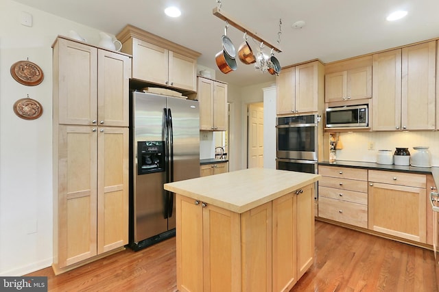 4614 Demby Dr, Fairfax, VA 22032 - kitchen featuring appliances with stainless steel finishes, light brown cabinets, light wood-style flooring, a kitchen island, and recessed lighting