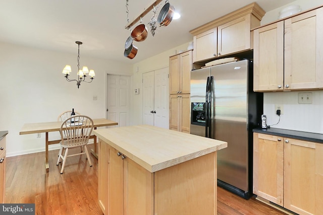 4614 Demby Dr, Fairfax, VA 22032 - kitchen featuring stainless steel refrigerator with ice dispenser, light wood-type flooring, light brown cabinets, a center island, and hanging light fixtures