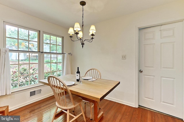 4614 Demby Dr, Fairfax, VA 22032 - dining area with baseboards, a chandelier, and wood finished floors