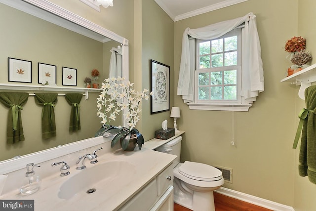 4614 Demby Dr, Fairfax, VA 22032 - bathroom with crown molding, vanity, toilet, wood finished floors, and baseboards