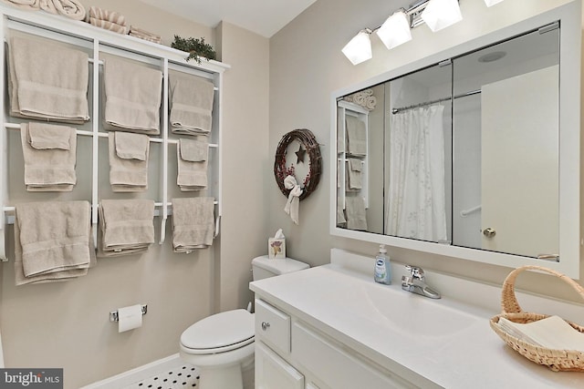 4614 Demby Dr, Fairfax, VA 22032 - bathroom featuring toilet, vanity, curtained shower, and baseboards