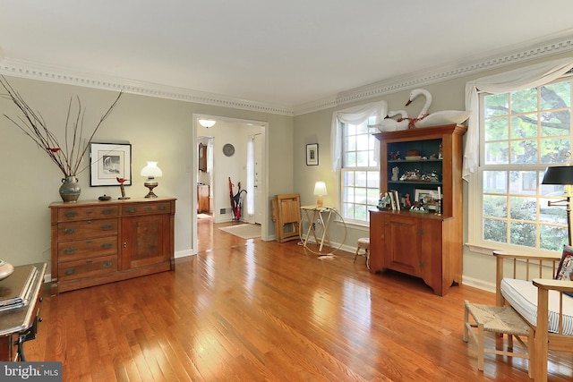 4614 Demby Dr, Fairfax, VA 22032 - sitting room with light wood finished floors, healthy amount of natural light, crown molding, and baseboards