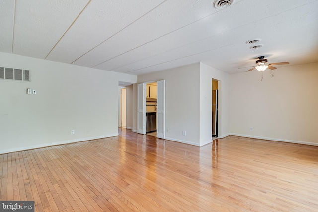 5707 Indian Ct Unit 31, Alexandria, VA 22303 - unfurnished room featuring light wood-style floors, a ceiling fan, baseboards, and a textured ceiling
