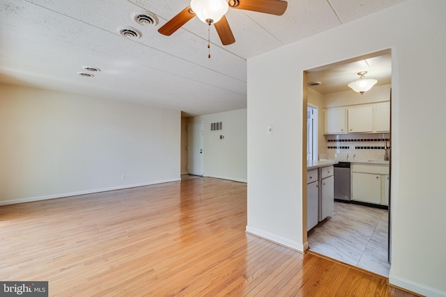5707 Indian Ct Unit 31, Alexandria, VA 22303 - spare room with light wood finished floors, a ceiling fan, and baseboards