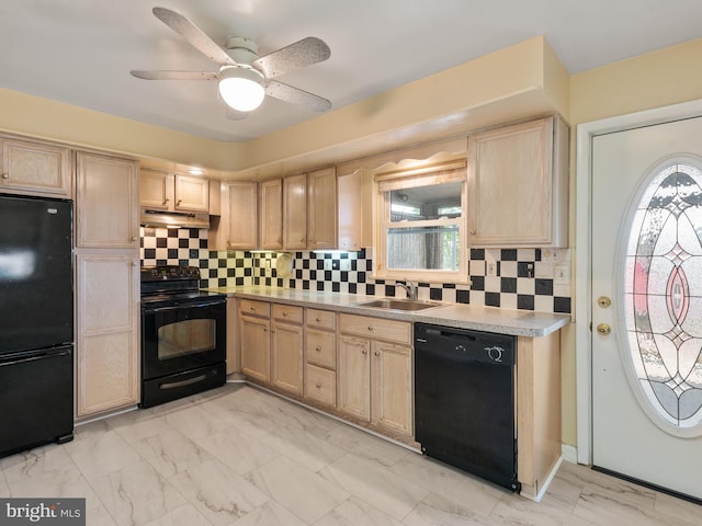 kitchen with black appliances, a sink, under cabinet range hood, and light brown cabinetry