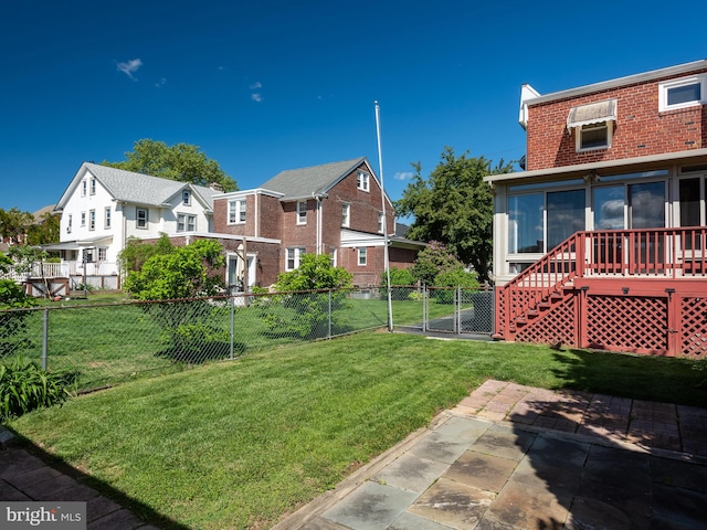 view of yard featuring a patio area and a sunroom