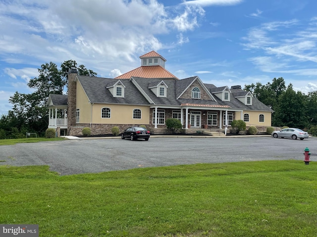 216 N Heron Ln, New Castle, DE 19720 - view of front of property featuring a standing seam roof, a front yard, metal roof, and a chimney
