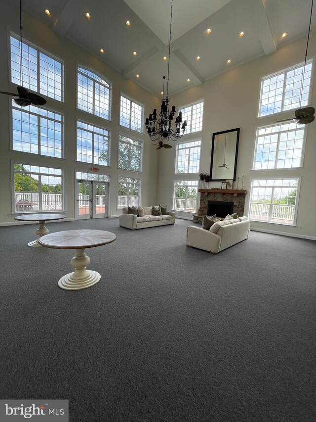 216 N Heron Ln, New Castle, DE 19720 - living room with a towering ceiling, recessed lighting, carpet, a chandelier, and a fireplace