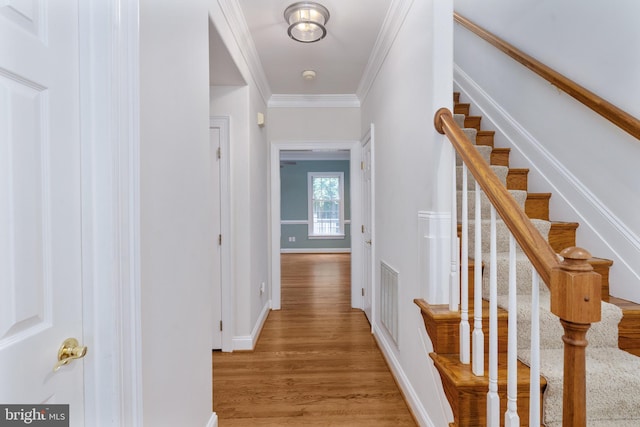 3910 Corbin Hall Ln, Fredericksburg, VA 22408 - corridor featuring light wood finished floors, stairway, crown molding, and baseboards