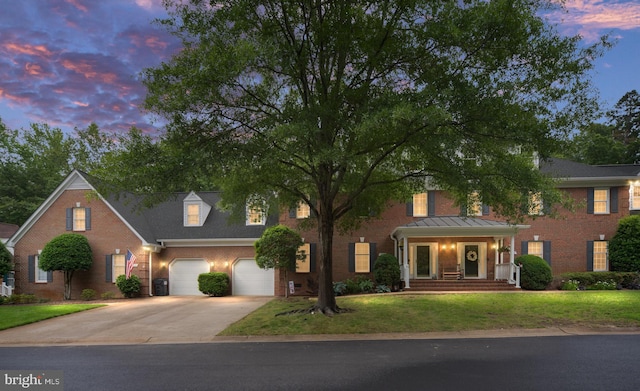 3910 Corbin Hall Ln, Fredericksburg, VA 22408 - view of front of property featuring driveway, an attached garage, a lawn, and brick siding