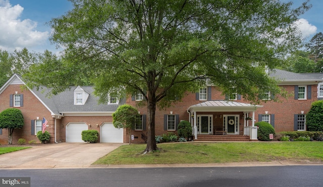 3910 Corbin Hall Ln, Fredericksburg, VA 22408 - view of front of property featuring driveway, brick siding, an attached garage, and a front lawn