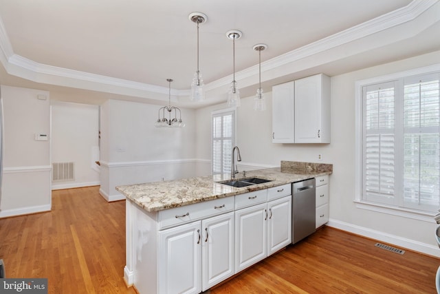 3910 Corbin Hall Ln, Fredericksburg, VA 22408 - kitchen featuring dishwasher, a sink, a peninsula, a raised ceiling, and light wood-type flooring