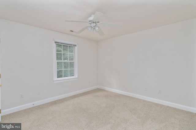 3910 Corbin Hall Ln, Fredericksburg, VA 22408 - spare room with baseboards, light carpet, and a ceiling fan