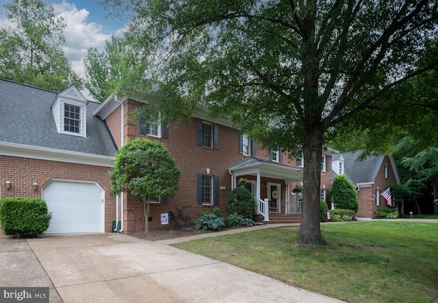 3910 Corbin Hall Ln, Fredericksburg, VA 22408 - view of front of house with covered porch, a front yard, driveway, brick siding, and a garage