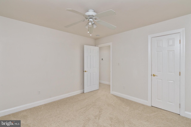 3910 Corbin Hall Ln, Fredericksburg, VA 22408 - unfurnished bedroom with light colored carpet, baseboards, and a ceiling fan