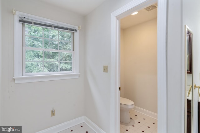 3910 Corbin Hall Ln, Fredericksburg, VA 22408 - bathroom with toilet, baseboards, and tile patterned flooring