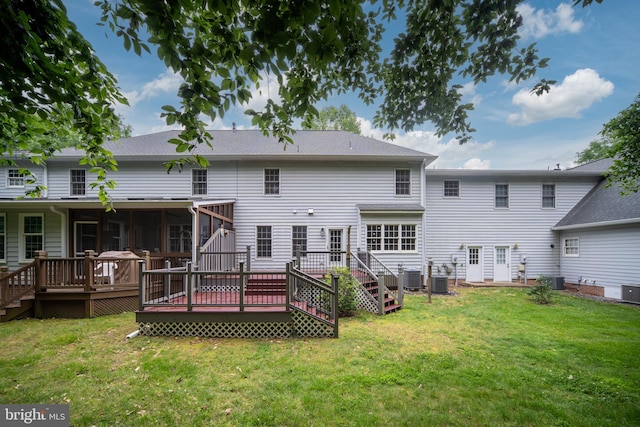 3910 Corbin Hall Ln, Fredericksburg, VA 22408 - back of property featuring a deck, a lawn, and central AC
