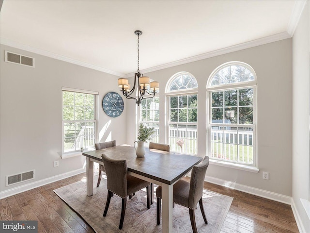 403 Joshua Ln, Middletown, DE 19709 - dining space with healthy amount of natural light, a chandelier, crown molding, and baseboards