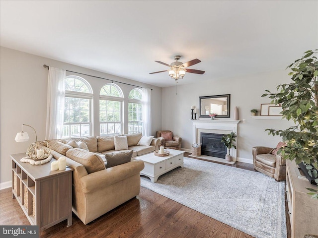 403 Joshua Ln, Middletown, DE 19709 - living room with a fireplace with flush hearth, wood finished floors, ceiling fan, and baseboards