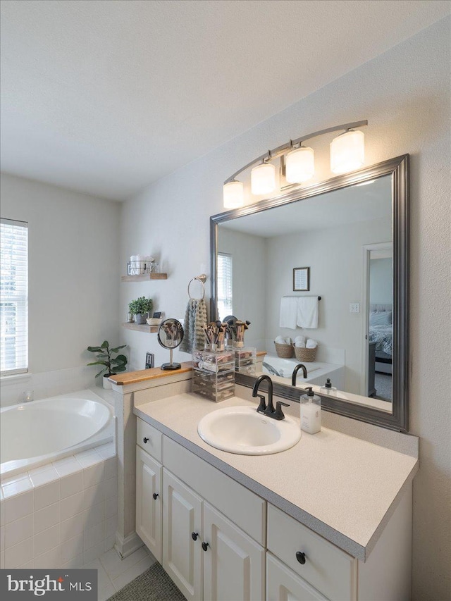 403 Joshua Ln, Middletown, DE 19709 - full bath featuring plenty of natural light, vanity, a bath, and tile patterned floors
