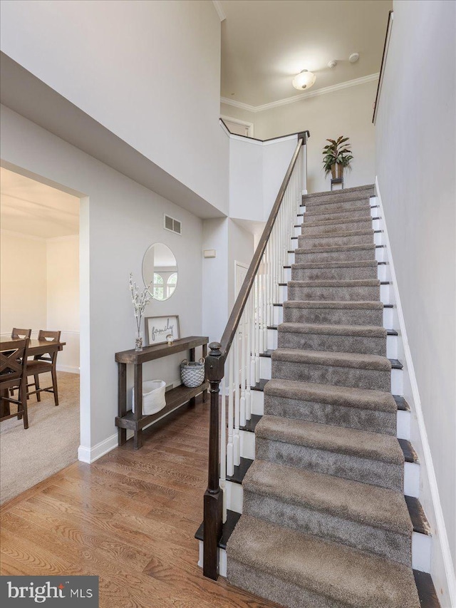 403 Joshua Ln, Middletown, DE 19709 - staircase featuring wood finished floors, baseboards, and ornamental molding