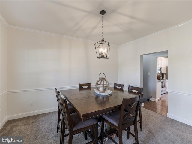403 Joshua Ln, Middletown, DE 19709 - dining room featuring ornamental molding, a chandelier, carpet floors, and baseboards