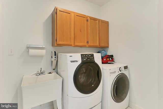 8265 Private Ln, Annandale, VA 22003 - laundry area with cabinet space, washer and clothes dryer, and baseboards
