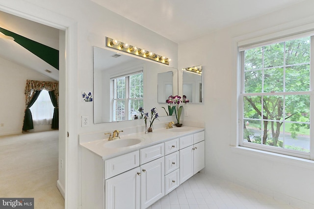 8265 Private Ln, Annandale, VA 22003 - bathroom featuring double vanity and baseboards