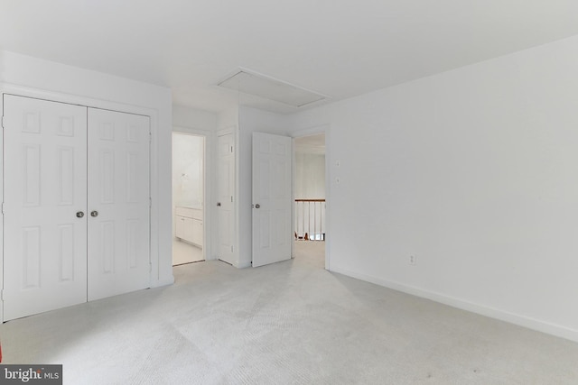 8265 Private Ln, Annandale, VA 22003 - unfurnished bedroom featuring attic access, light carpet, a closet, and baseboards