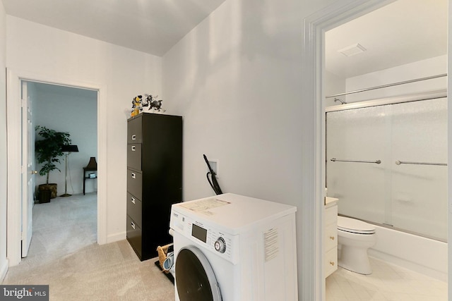 8265 Private Ln, Annandale, VA 22003 - bathroom with washer / clothes dryer, toilet, and combined bath / shower with glass door