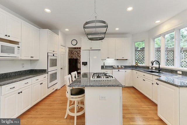 8265 Private Ln, Annandale, VA 22003 - kitchen featuring a sink, white appliances, recessed lighting, a center island, and white cabinetry
