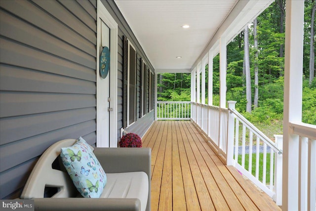 wooden terrace with a porch